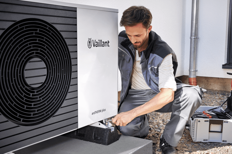 Installer working on a heat pump