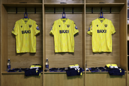 Three football shirts with Baxi branding.