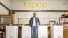 A picture of tepeo CEO Johan du Plessis in front of a tepeo sign.