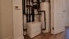 Image shows a Kensa Shoebox heat pump in situ at one of the Sutton Dwellings properties.
