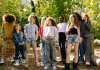 children in green forest clearing