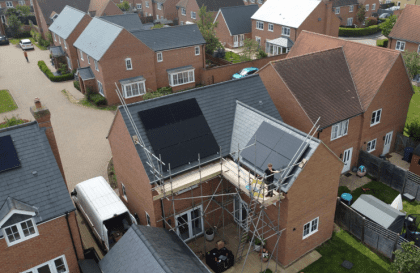 Aerial view of houses with scaffolding in place