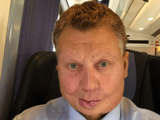 Man sat on seat on train